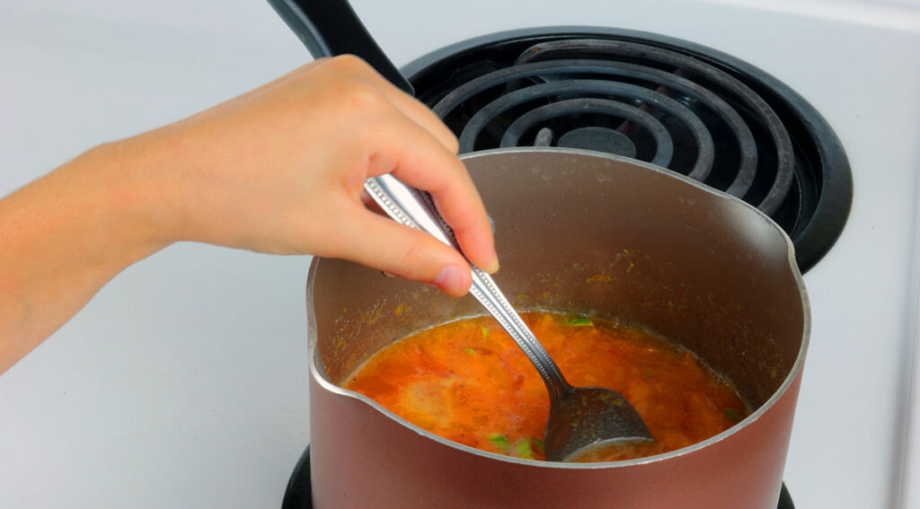 Cooking persimmon jam.